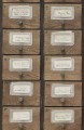 Mural szafki apteczne vintage Mind the Gap APOTHECARY Neutral WP20264 Premium Designer Wallpaper Collection